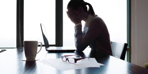 Workplace Stress - Office Worker Dealing with Stress